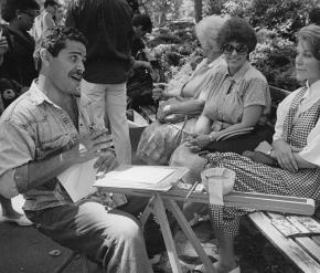 Manny Vega drawing people in the park in the 1980s.