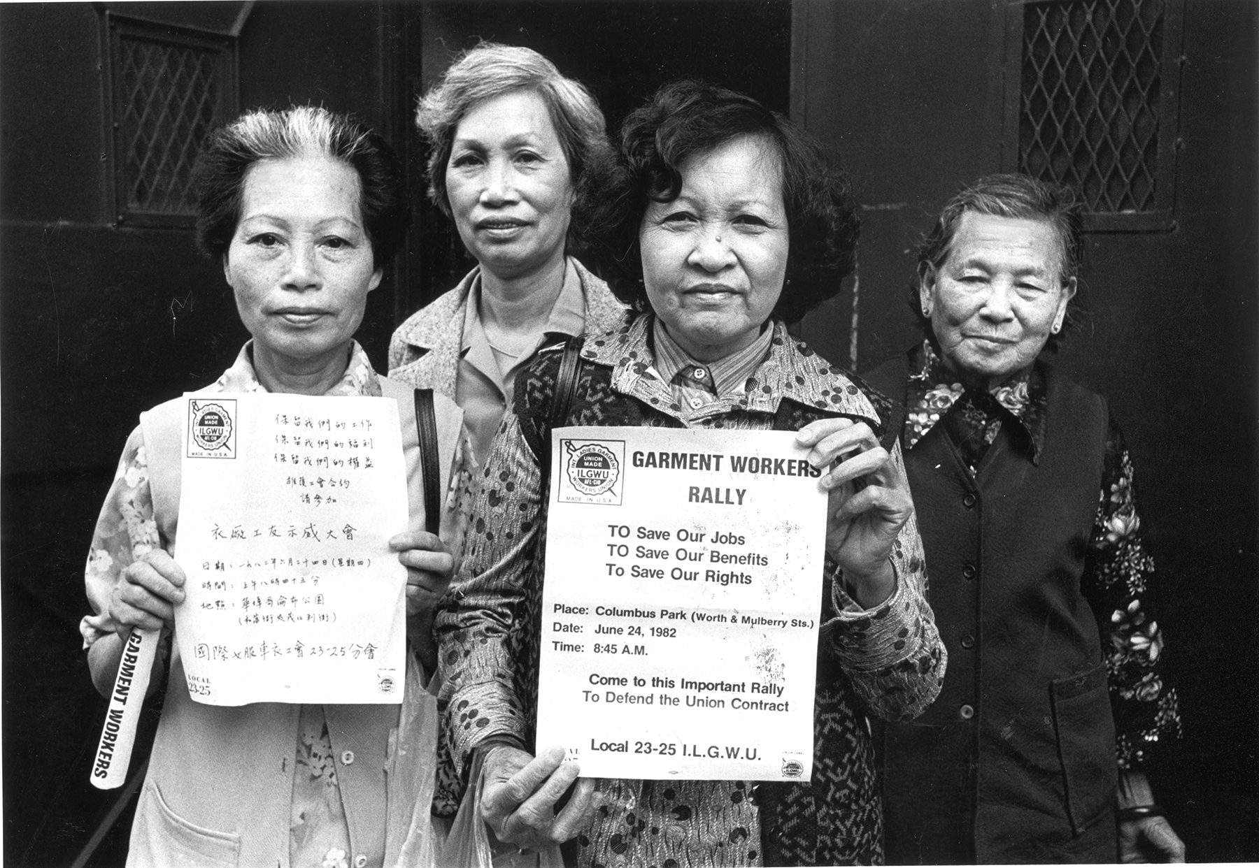 Members of the labor union ILGWU Local 23-25 look directly into the camera and hold up English and Chinese-language flyers in support of the strike against garment factories in New York City’s Chinatown. 