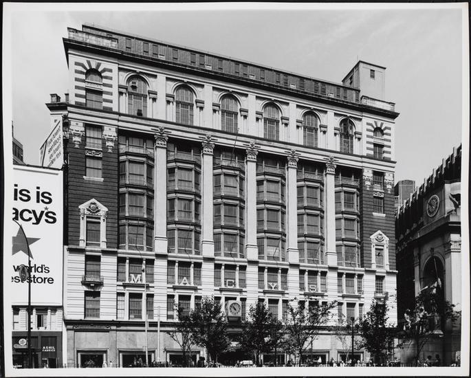 Black & white photograph of the Macy's building in Herald Square.