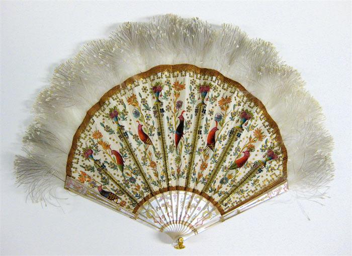 Fan made of white sticks, with detailed birds and flowers painted on the fabric between the ribs, and feathers on the top