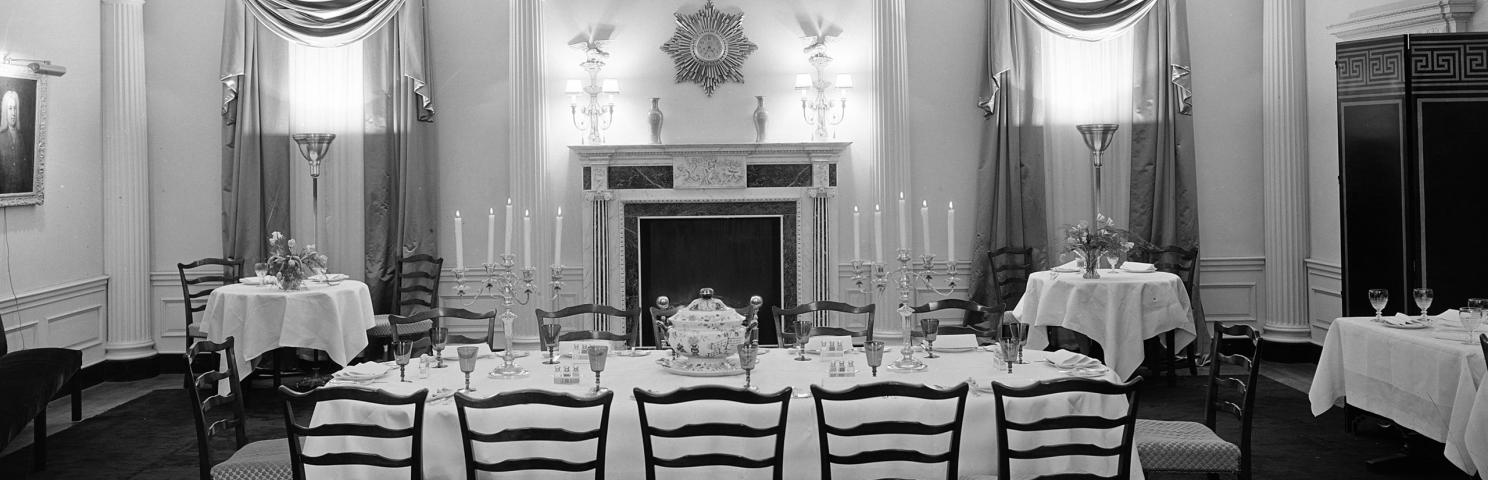 Extravagantly furnished dining room at 960 Fifth Avenue. The setting includes a central table with elaborate place settings.