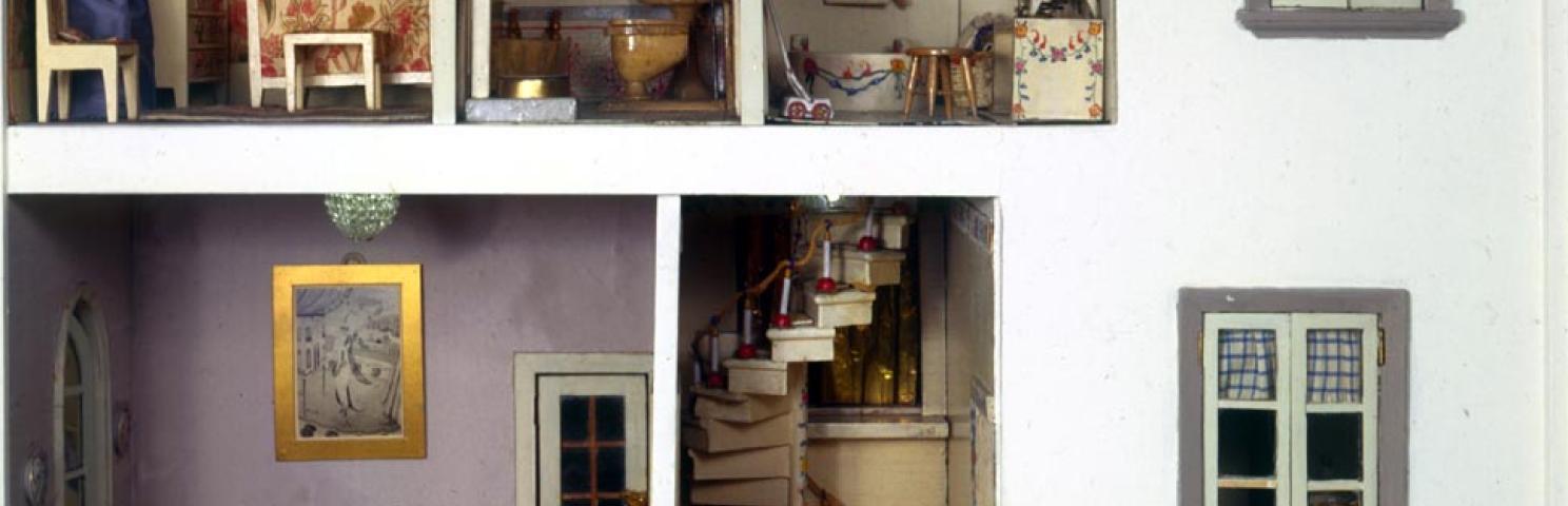 View of two windows, staircase, and furnished dining room, bathroom, and bedroom in the Stettheimer Dollhouse