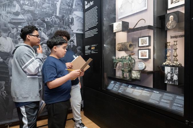 Three students looking at a case in NY at its Core