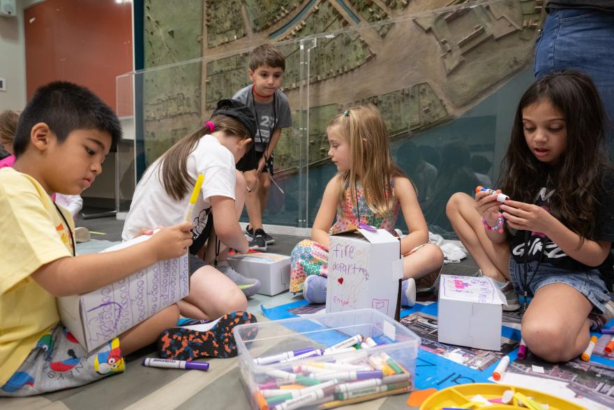 A group of students participating in an art activity. 