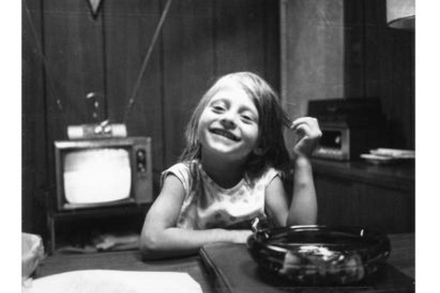 a black and white childhood photograph of Maria Bartiromo