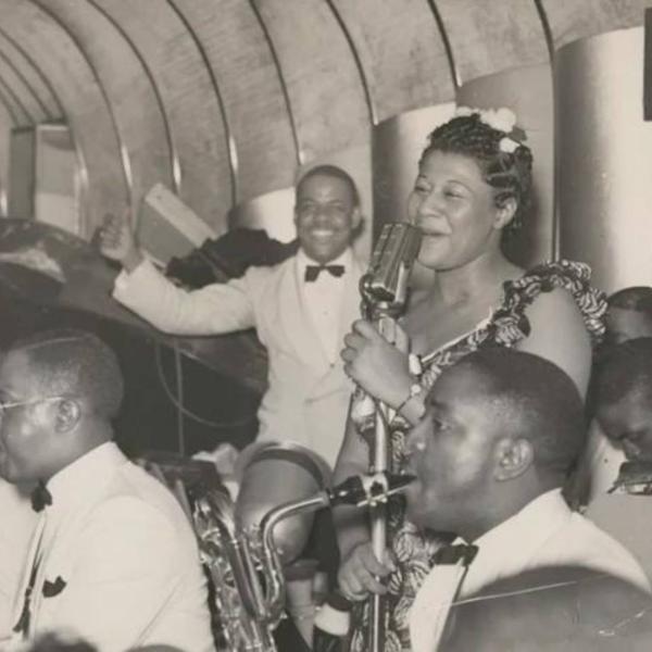 Chick Webb and musicians performing.