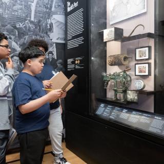 Three students looking at a case in NY at its Core