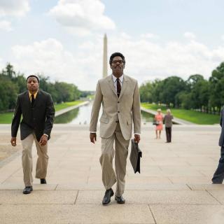 Colman Domingo as Bayard Rustin walks along the Washington Mall. 