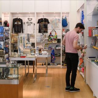 A man stands in a shop. 